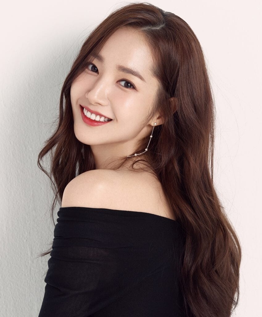 Actress Park Min-young showcasing the gold standard of harmonious and natural Korean plastic surgery results.